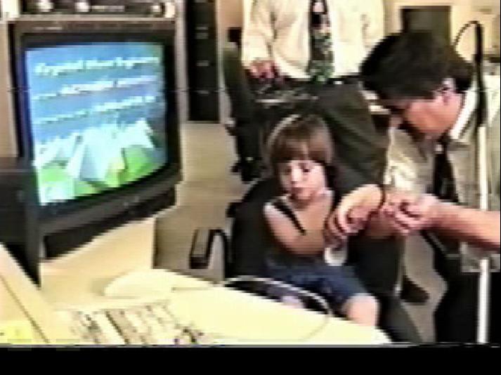 A teacher instructs a child using virtual realtiy