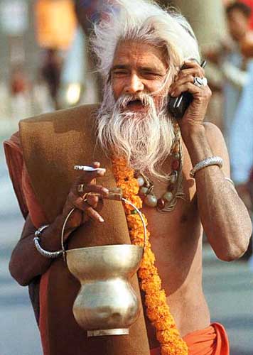 An Indian Monk with a mobile phone