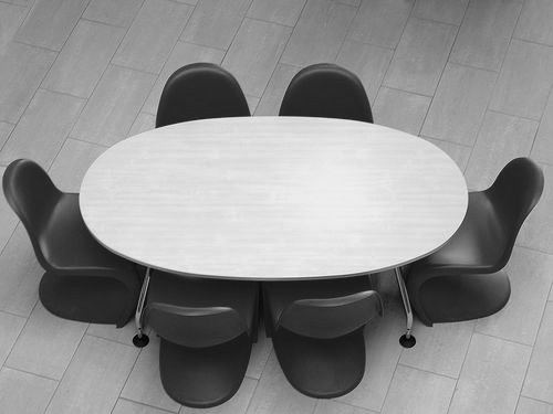 The W3C is a set of tables around which members gather and sit to discuss and agree on something