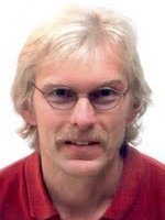 Headshot of John Erickson, co-author of DCAT