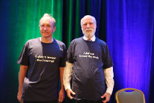 Tim Berners-Lee and Vint Cerf show one side of their T-shirts, saying who did not invent what