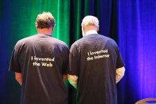Tim Berners-Lee and Vint Cerf show the other side of their T-shirts, saying who invented what