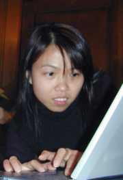 Yammie Yuen typing on a laptop