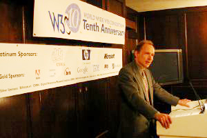 Tim Berners-Lee speaking, W3C10 and sponsor banners