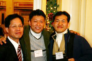 Three attendees smiling