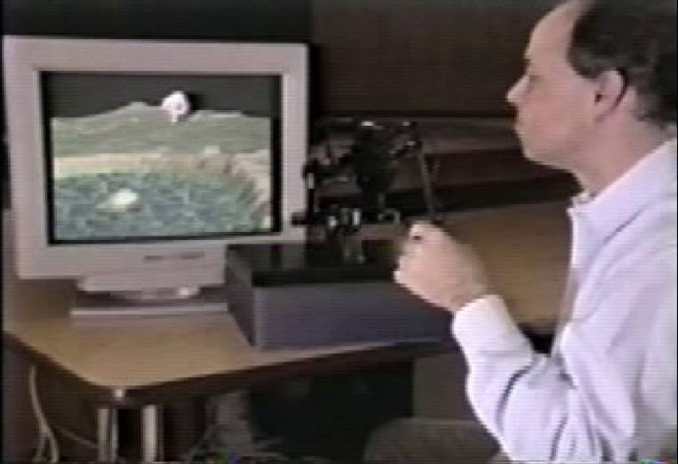 Photo of man sitting in front of a computer