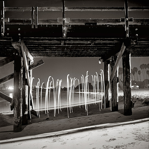 Drawing with light under a bridge.