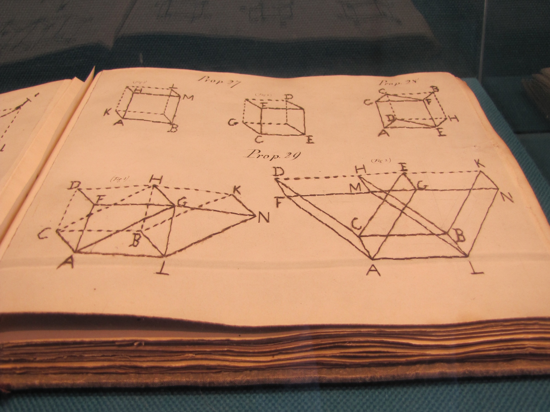 Page from a tactile book on Euclidian Geometry from 1860, on display at the Museum of the Perkins School for the Blind.  The geometric figures are hand stitched onto the page.
