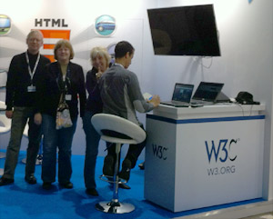 Dave Raggett, Marie-Claire Forgue, Dominique Hazael-Massieux at the W3C booth