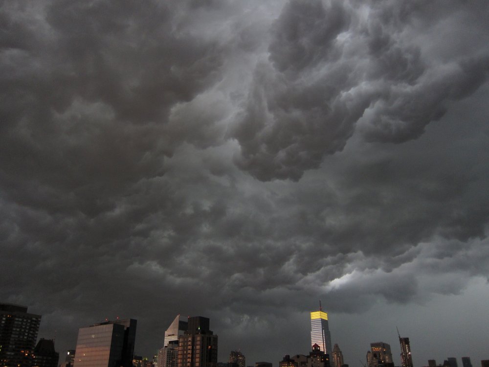 Dark storm clouds gathering over the New York skyline.