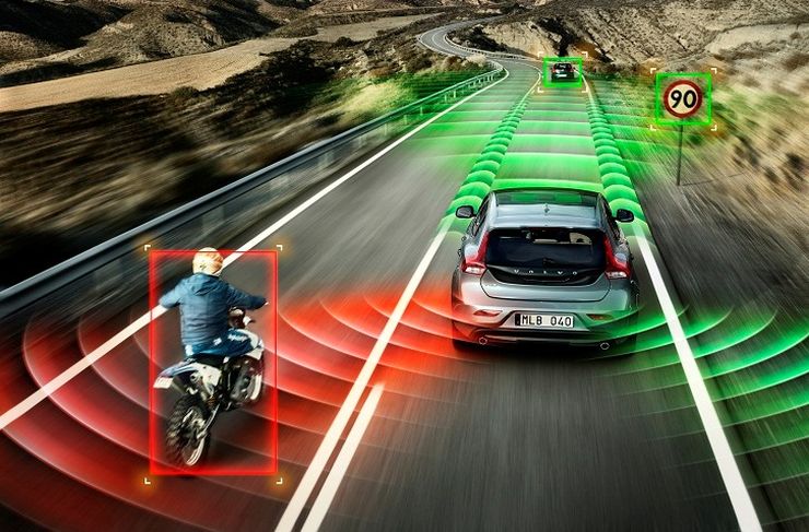 A photo of a motorbike overtaking a car on an open road. Red and green waves are overlayed to suggest each behicle has multiple sensors