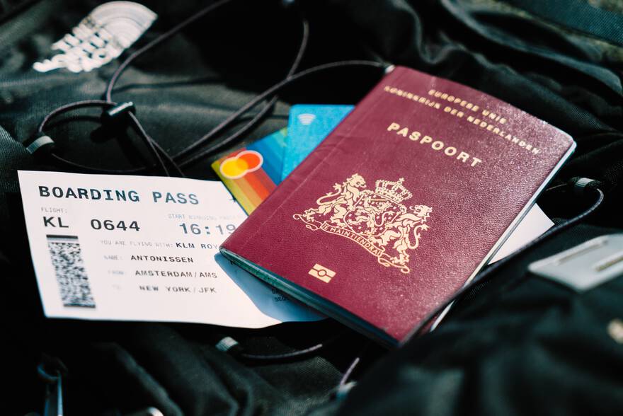 [illustration: photo of a boarding pass and a passport]