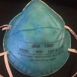 [photo of a surgical N95
	  respirator]