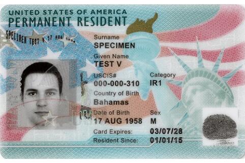 A picture of a United States Citizenship and Immigration Services Permanent Resident Card that contains a picture of the individual and a variety of information about the individual such as their name, government issued identifier, where they were born, and other biographic and biometric information that can be used to identify the individual.