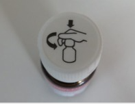 Push the cap down and turn it counter-clockwise.