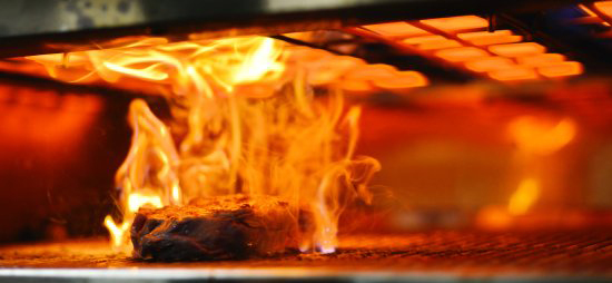 food on fire under broiler